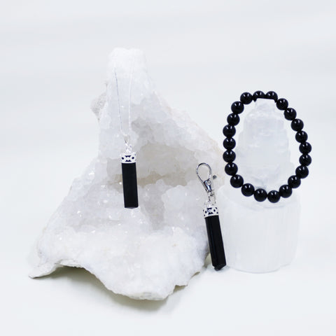 Image of Black Tourmaline energy crystals on necklaces and lobster clasp clip pendants from Hound and Friends